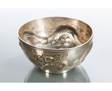 CHINESE SILVER CIRCULAR BOWL
embossed with a dragon around the body, maker Wang Hing, engraved around the base rim Soldiers C