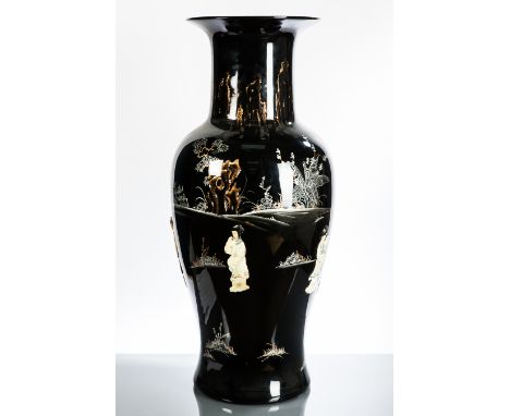 LARGE CHINESE CERAMIC VASE
with females in relief in an architectural landscape setting on a black ground with gilt detailing