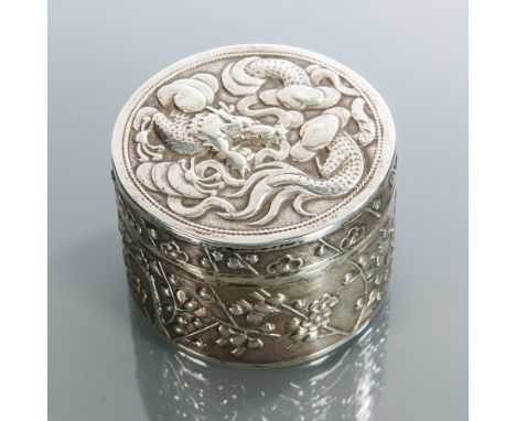 CHINESE SILVER CIRCULAR BOX
the lid embossed with a dragon and with blossom to the body, maker Wang Hing, 63g, 6cm diameter, 