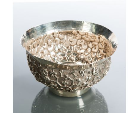 CHINESE SILVER CIRCULAR BOWL
with everted rim over a body of blossom, approximately 131g, 13cm diameter, unmarked 