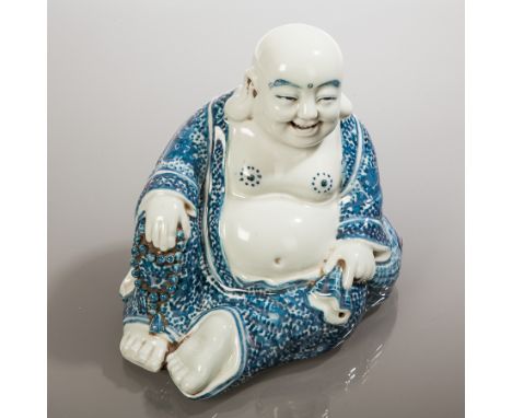 CHINESE BLUE AND WHITE PORCELAIN FIGURE OF A SEATED BUDDHA
impressed seal mark to base, 16cm high