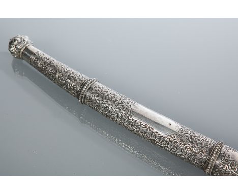 BURMESE SWORD IN THE STYLE OF A DRESS DHA 
the hilt and scabbard in sheet silver with scrolling decoration overall, 84cm long