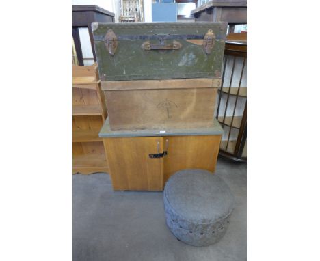 A fitted school cabinet, a military style trunk, a wooden toolbox and a circular pouffe/ottoman