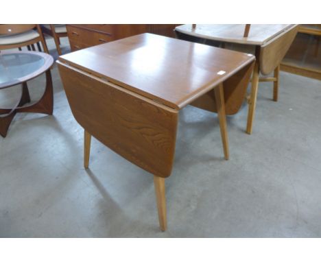 An Ercol drop-leaf table
