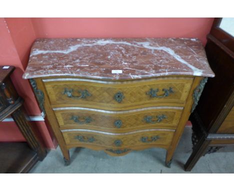 A French Louis XV style mahogany and parquetry inlaid serpentine petit commode, with rouge marble top