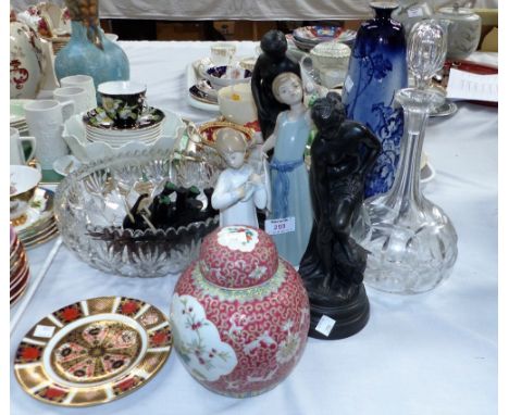 A Lladro figure of a young girl; another similar (a.f.); a cut glass decanter; other decorative items