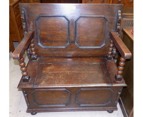 A 1930's oak box seat monk’s bench