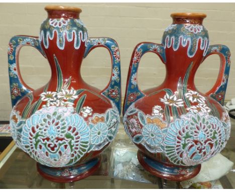 A pair of 1920's/30's double gourd shaped Satsuma vases with raised enamel decoration, height 13"