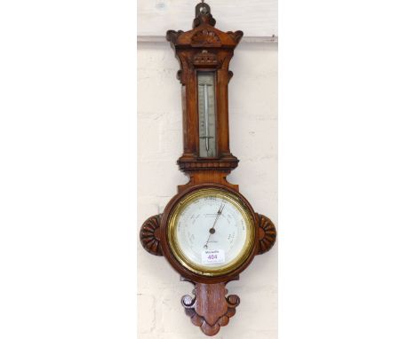 An Edwardian Arts & Crafts style aneroid barometer/thermometer