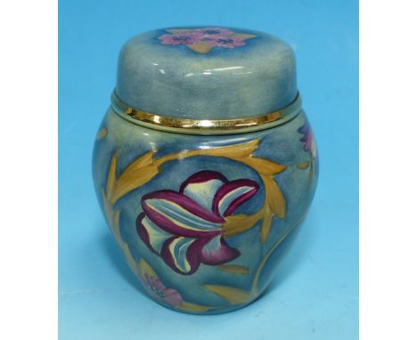 A Moorcroft miniature enamel covered vase decorated with pink flowers against a mottled blue/green ground, in original box, h