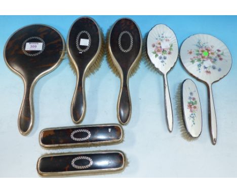 A silver and tortoiseshell back 5 piece dressing table set, Birmingham 1925; a silver plate and white enamel hand mirror and 