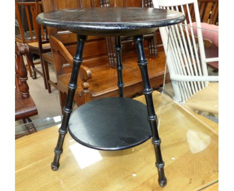 A Victorian Aesthetic Movement ebonised 2 tier tripod occasional table with simulated bamboo supports, with paper label of Wi