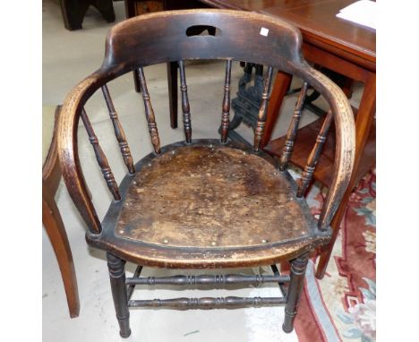 An early 20th century stick back bow shaped armchair