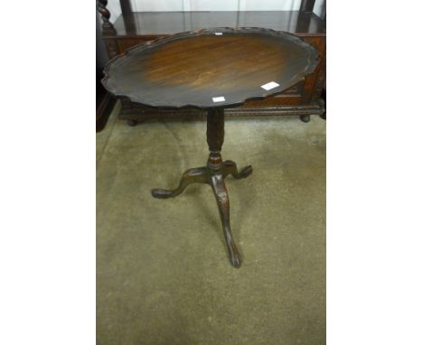 A Chippendale Revival mahogany oval tripod lamp table 