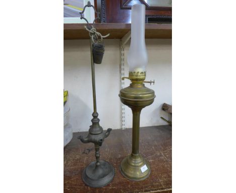 A brass oil lamp and an early gas fitting 