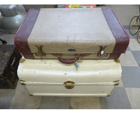 A painted tin steamer trunk and a vintage suitcase 
