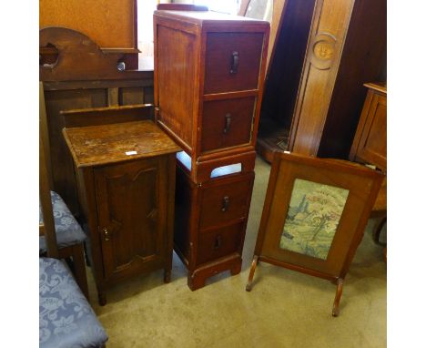 An oak bedside table, a pair of pedestal chests and a firescreen 