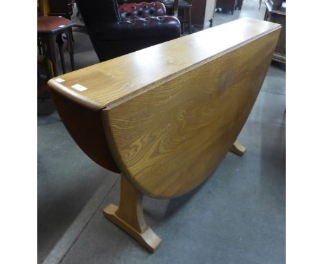 An Ercol Blonde drop-leaf table 