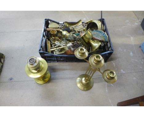 A box of assorted brassware, including a model of Stephenson's rocket and tender, Art Nouveau style three branch candlestick,