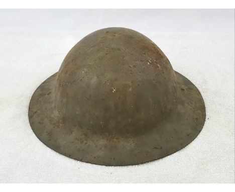 WW1 1st Pattern British Raw Edge Brodie Helmet. One of the lugs has had a period field repair, but still remains totally orig