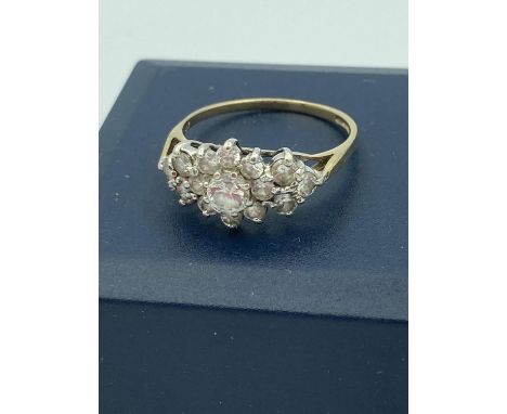 9 carat GOLD CLUSTER RING ,having 15 sparkling zirconias set to top. 2.0 grams. Size N. 