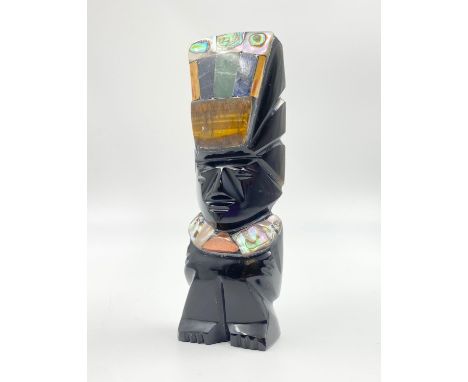 A Hand-Carved Obsidian Mayan Aztec God Figurine with Inlaid Mother of Pearl and other semi-precious gemstones. 13cm tall. 