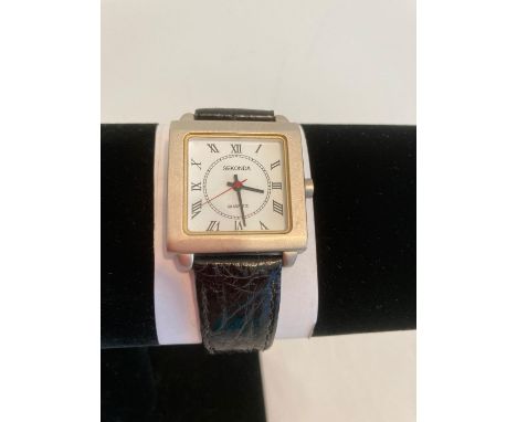 Gentlemans Sekonda square Quartz wristwatch. Rare and unusual model having a completely square white face ,black Roman numera