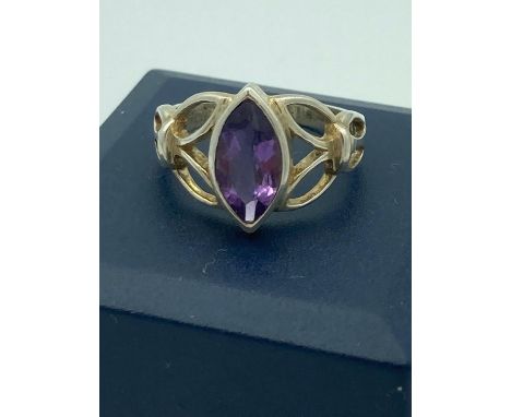 Stone set SILVER RING having AMETHYST  to top in Navette style with attractive silver detail to shoulders.Size O 1/2. 