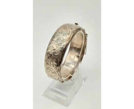 A Vintage Silver Engraved Bangle. 6cm diameter. 33g 