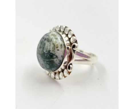 A Silver and Moss Agate Ring. Size T. 