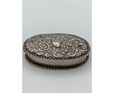 Antique SILVER SNUFF BOX in oval form having clear hallmark for Adie and Lovekin ,Birmingham 1900. Hinged lid having repousse