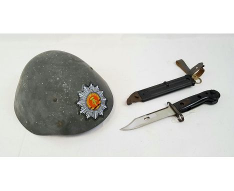 Former East German Border Guard AK-47 Bayonet &amp; lightweight fibre helmet. The bayonet turns into a wire cutter. 