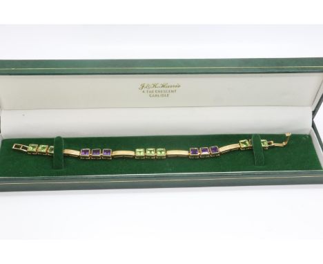 9ct gold bracelet set with peridot and amethyst, L: 20 cm, 16.1g. P&amp;P Group 1 (£14+VAT for the first lot and £1+VAT for s