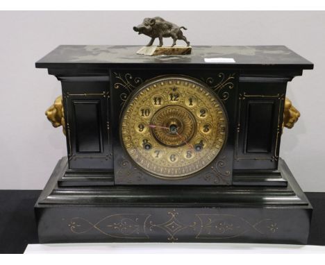 Late 19th century Ansonia mantel clock, the cast metal case gilt with lion masks, later surmounted with a boar figure, chimin