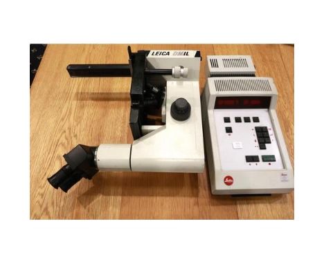 Leica DMIL binocular microscope, the lenses that come with the microscope are Leitz periplan 10x/18. P&amp;P Group 3 (£25+VAT
