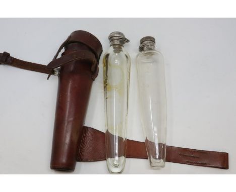 Three unusual spirit flasks of conical form with silver plate bayonet tops ( 10 inch 9 inch 8 inch ) with leather carry case.