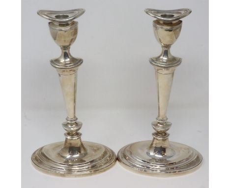 Pair of hallmarked silver weighted candlesticks, Birmingham assay, H: 29 cm, both slightly stand off centre. P&amp;P Group 2 