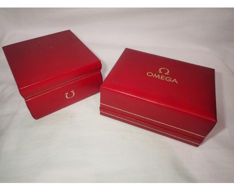 Two red leather Omega wristwatch boxes. P&amp;P Group 1 (£14+VAT for the first lot and £1+VAT for subsequent lots) 