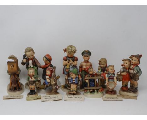 Twelve Goebel figurines with a book and other related ephemera, no cracks or chips, largest H: 16 cm. P&amp;P Group 3 (£25+VA