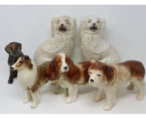 Six ceramic dogs including a pair of Victorian fireside dogs, largest H: 26 cm, signs of age throughout. P&amp;P Group 3 (£25