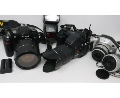 Olympus E-20P and a Nikon D70 with accessories. P&amp;P Group 2 (£18+VAT for the first lot and £3+VAT for subsequent lots) 