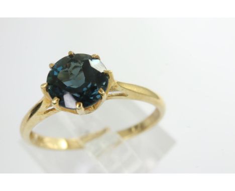 9ct gold solitaire ring set with blue tourmaline, size N/O, 1.5g. P&amp;P Group 1 (£14+VAT for the first lot and £1+VAT for s