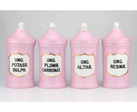 Set of 4 Large Ceramic Apothecary Jars, English, late 19th Century, finished in pink with gilt banding and edging to sheild s