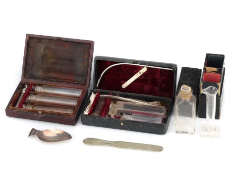 A Group of Medical and Pharmacy Instruments, including: an English, 19th Century, travelling set containing a facet-cut glass