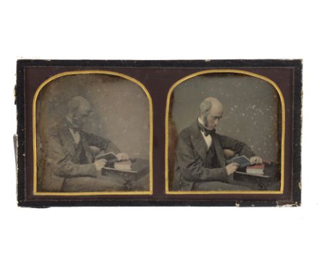 Stereo Daguerreotype Stereo Daguerreotype showing a seated gentleman reading a book. Nicely tinted. Oxidation to image edges.