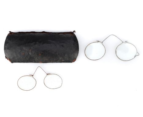 A Pair of Single-Wire 'Toy' Nose Spectacles, possibly German, possibly 19th Century, thin brass or copper wire, with oval len