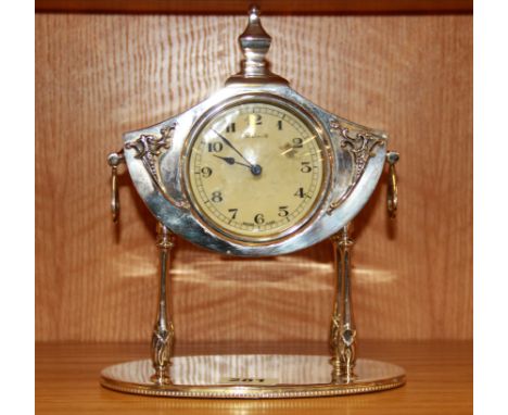 An early 20th Century silverplated eight day mantle clock, H. 25cm.