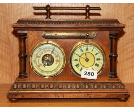 An interesting early 20th Century oak cased clock barometer and thermometer, size 30 x 23cm.