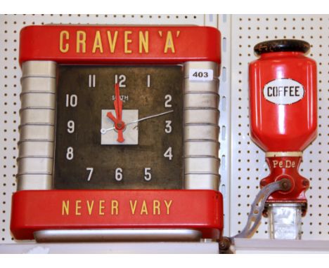 A Craven 'A' advertising clock and a vintage coffee grinder.