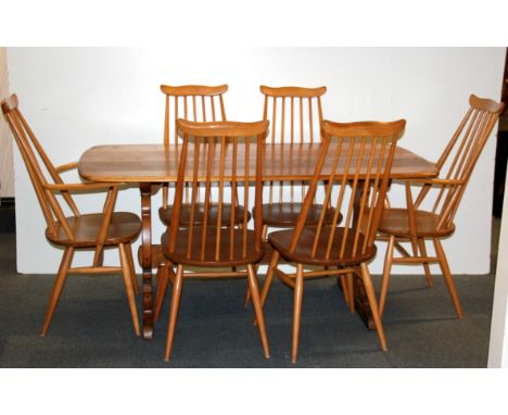 A lovely Ercol refectory dining table and six chairs, size 152 x 76cm.